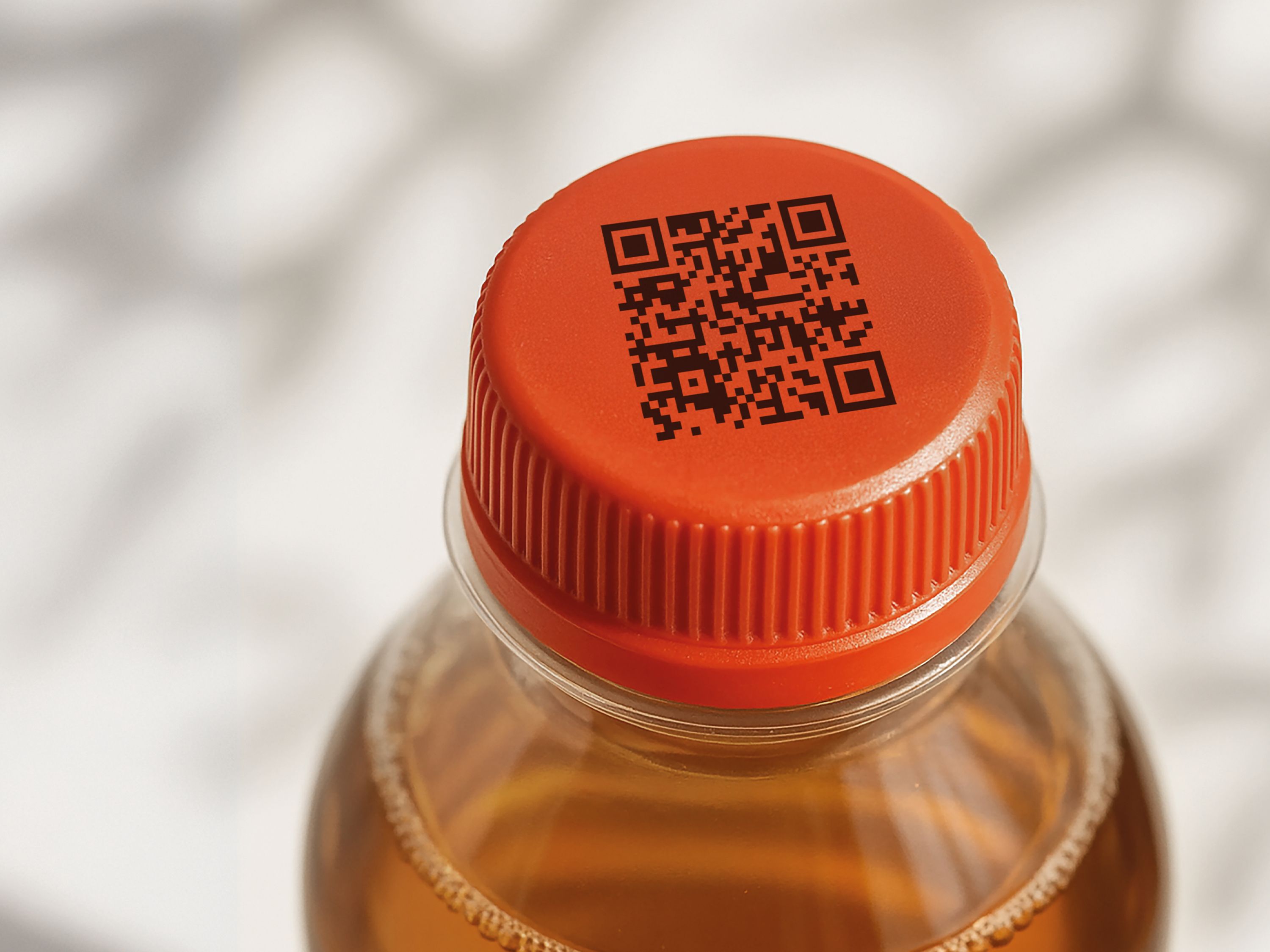 QR sobre tapon de botella PET_coding_on_plastic_bottle_cap